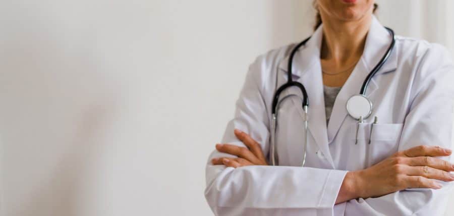 Physician in a white coat with a stethoscope